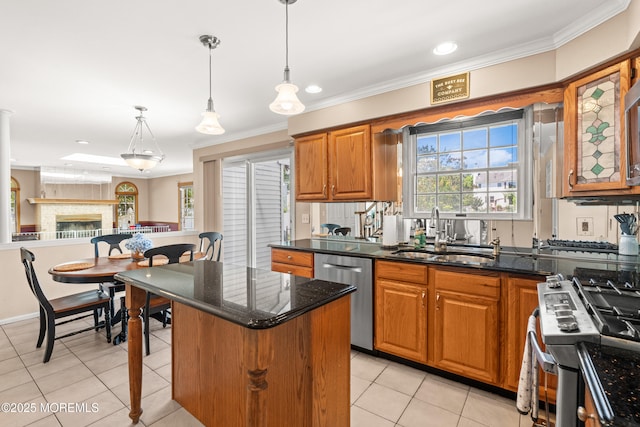 51 Davids Ln, Howell, NJ 07731 - kitchen with stainless steel appliances, brown cabinetry, a kitchen island, light tile patterned floors, and ornamental molding