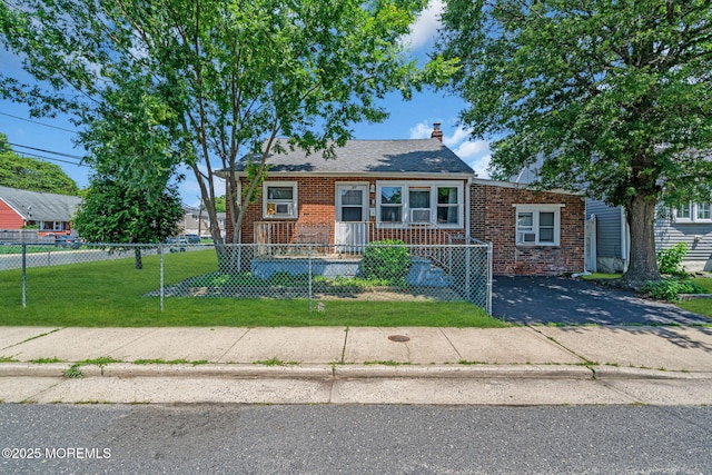 37 Kennedy Way, Keansburg, NJ 07734 - bungalow with brick siding, a fenced front yard, and a chimney
