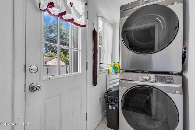 37 Kennedy Way, Keansburg, NJ 07734 - laundry room with stacked washer / dryer, healthy amount of natural light, and light tile patterned floors