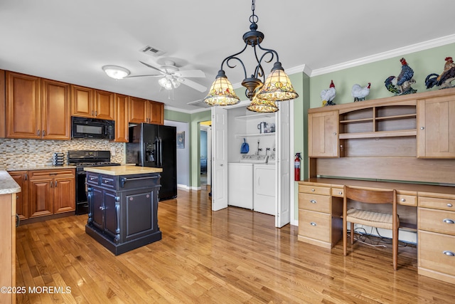 3 Redlands Ct, Toms River, NJ 08757 - kitchen with black appliances, independent washer and dryer, ornamental molding, light countertops, and a ceiling fan