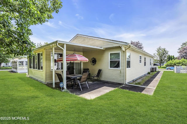 3 Redlands Ct, Toms River, NJ 08757 - back of house featuring a lawn and a patio