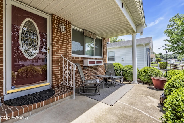 3 Redlands Ct, Toms River, NJ 08757 - property entrance with brick siding and a porch