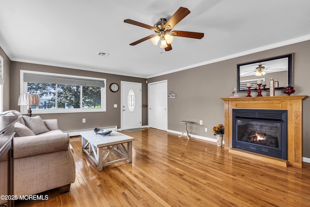 3 Redlands Ct, Toms River, NJ 08757 - living area featuring light wood-style flooring, a ceiling fan, crown molding, a glass covered fireplace, and baseboard heating