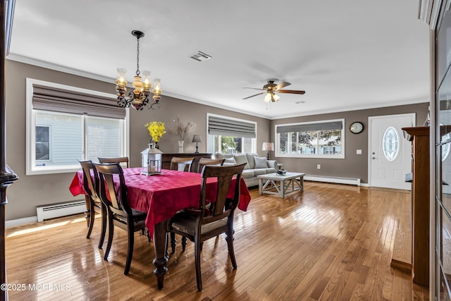 3 Redlands Ct, Toms River, NJ 08757 - dining area featuring a baseboard heating unit, a chandelier, crown molding, ceiling fan, and hardwood / wood-style flooring