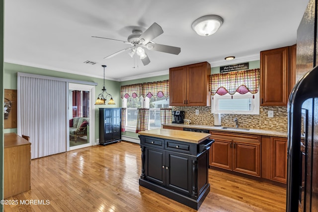 3 Redlands Ct, Toms River, NJ 08757 - kitchen with butcher block counters, decorative backsplash, a ceiling fan, a kitchen island, and pendant lighting