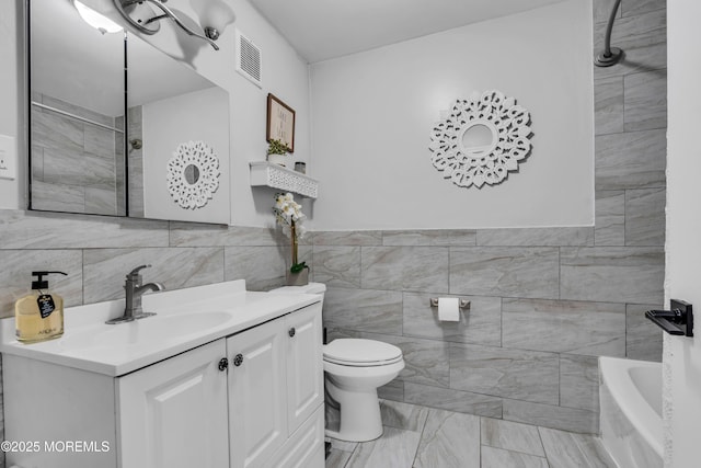 193 Sierra Ct, Woodbridge, NJ 07095 - full bathroom featuring tile walls, marble finish flooring, vanity, and a tub to relax in