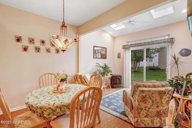 41 Sunrise Bay Blvd, Little Egg Harbor, NJ 08087 - dining space with a skylight, a wood stove, light wood finished floors, and recessed lighting