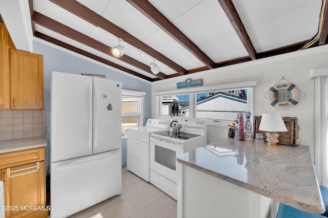 8 Ralph Ln, Beach Haven West, NJ 08050 - kitchen with white appliances, separate washer and dryer, backsplash, a peninsula, and light tile patterned floors