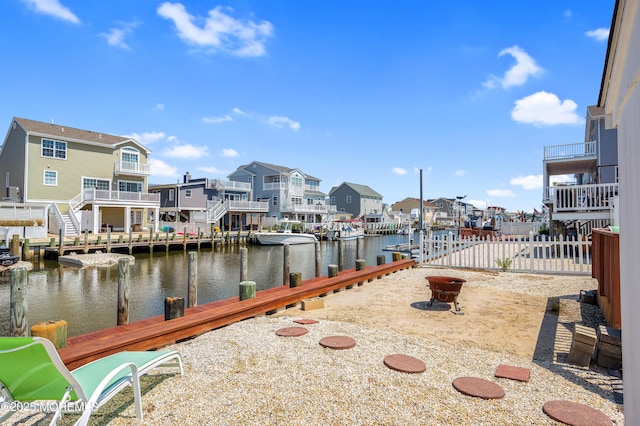 8 Ralph Ln, Beach Haven West, NJ 08050 - dock with a residential view, a water view, and an outdoor fire pit