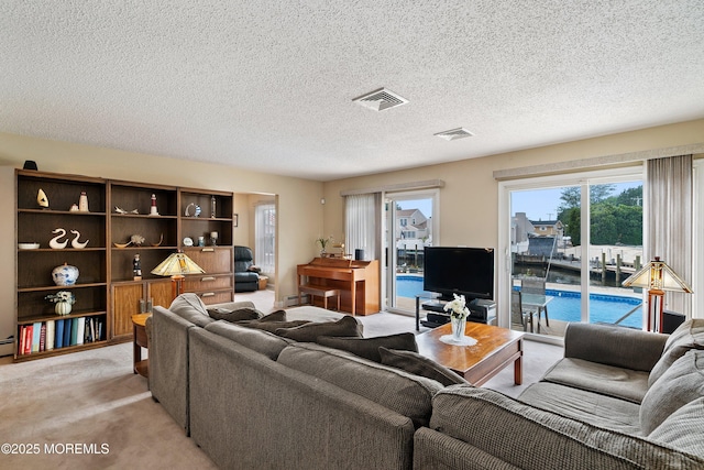 54 Storm Jib Ct, Bayville, NJ 08721 - living room featuring light colored carpet and a textured ceiling