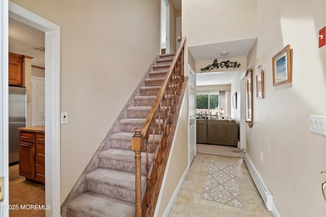 54 Storm Jib Ct, Bayville, NJ 08721 - stairs featuring baseboard heating and tile patterned flooring