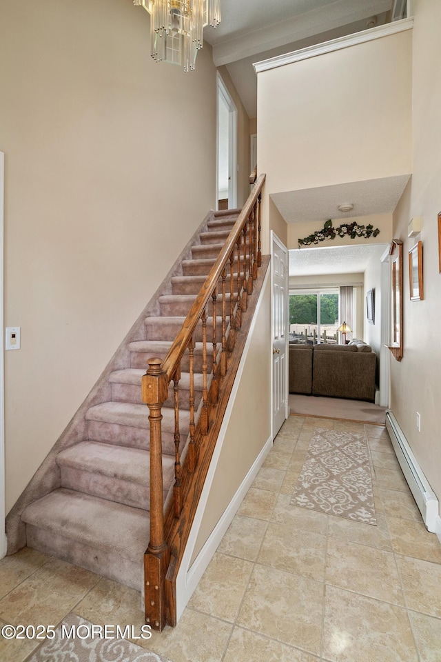 54 Storm Jib Ct, Bayville, NJ 08721 - staircase with a baseboard heating unit and a chandelier