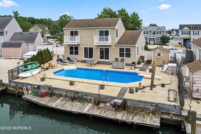 54 Storm Jib Ct, Bayville, NJ 08721 - swimming pool with a shed, a fenced backyard, a patio, a residential view, and a diving board