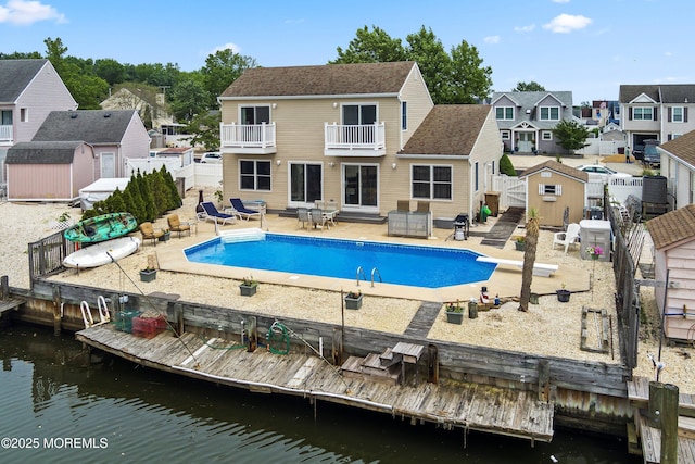 54 Storm Jib Ct, Bayville, NJ 08721 - outdoor pool featuring a shed, a fenced backyard, a patio area, a residential view, and a diving board