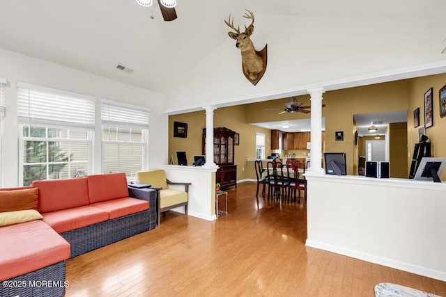 35 Kings N Rd, Jackson, NJ 08527 - living area featuring ornate columns, ceiling fan, light wood-style floors, healthy amount of natural light, and a high ceiling