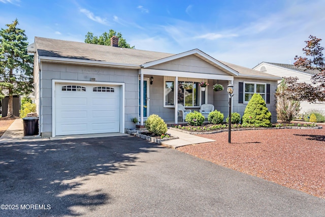 23 Auburn Rd, Toms River, NJ 08757 - ranch-style home featuring a garage, a chimney, a porch, driveway, and a shingled roof