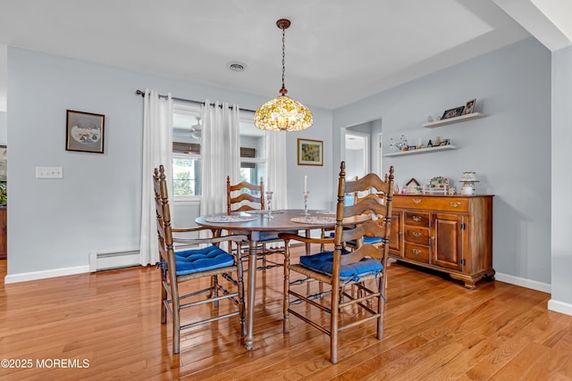23 Auburn Rd, Toms River, NJ 08757 - dining area featuring a baseboard radiator, light wood finished floors, and a chandelier
