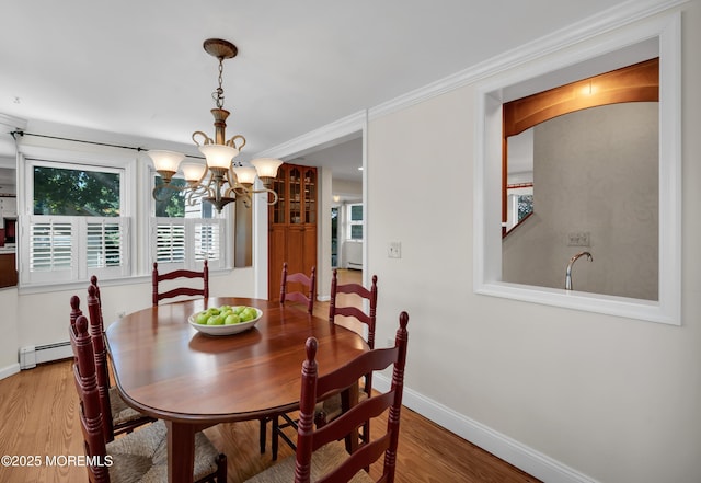 340 Main Ave, Bay Head, NJ 08742 - dining area with a chandelier, baseboard heating, and wood finished floors