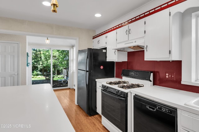 340 Main Ave, Bay Head, NJ 08742 - kitchen featuring black appliances, under cabinet range hood, light countertops, white cabinetry, and light wood-style flooring