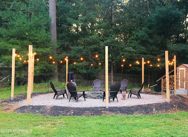 74 Squankum Rd, Tinton Falls, NJ 07724 - view of patio / terrace featuring a storage shed and an outdoor fire pit