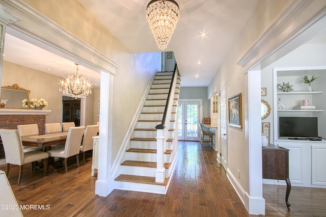 74 Squankum Rd, Tinton Falls, NJ 07724 - stairway featuring a chandelier, hardwood / wood-style floors, and built in features