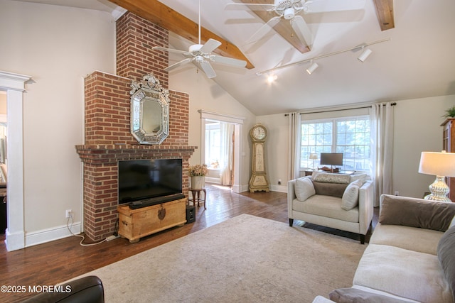 74 Squankum Rd, Tinton Falls, NJ 07724 - living room featuring rail lighting, wood finished floors, a fireplace, high vaulted ceiling, and a ceiling fan