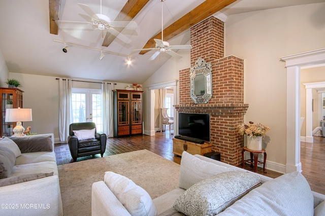 74 Squankum Rd, Tinton Falls, NJ 07724 - living area with a fireplace, track lighting, hardwood / wood-style floors, ceiling fan, and high vaulted ceiling