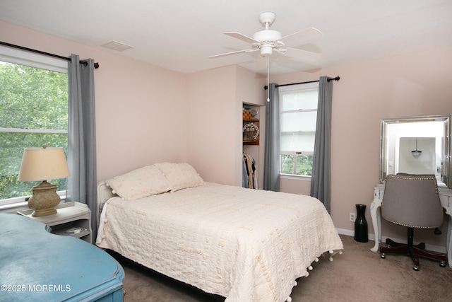 74 Squankum Rd, Tinton Falls, NJ 07724 - carpeted bedroom with multiple windows and a ceiling fan