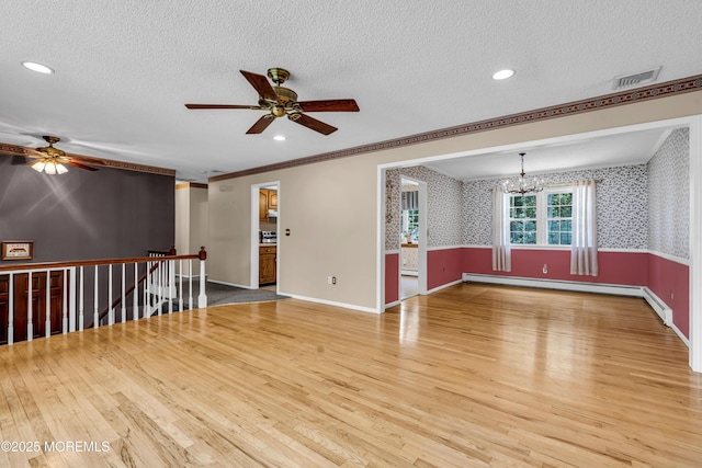 27 Greenhill Dr, Brick, NJ 08724 - unfurnished room with a ceiling fan, wood finished floors, a baseboard heating unit, a textured ceiling, and a chandelier