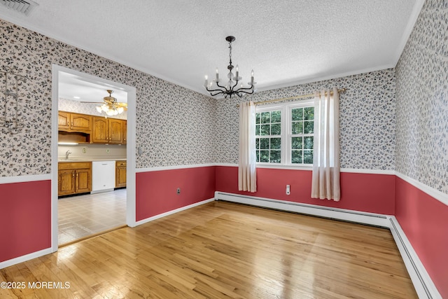 27 Greenhill Dr, Brick, NJ 08724 - unfurnished dining area with crown molding, a chandelier, a textured ceiling, wallpapered walls, and baseboard heating