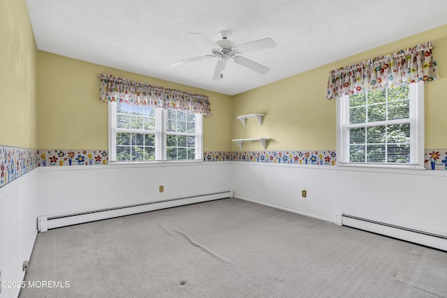 27 Greenhill Dr, Brick, NJ 08724 - spare room with baseboard heating, wainscoting, carpet flooring, ceiling fan, and a textured ceiling
