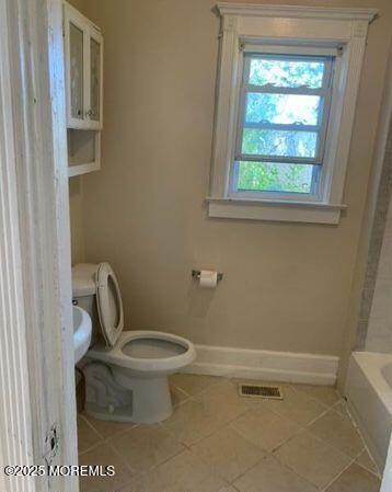 1604 Bangs Ave, Asbury Park, NJ 07712 - full bathroom featuring tile patterned floors, a bath, and a shower