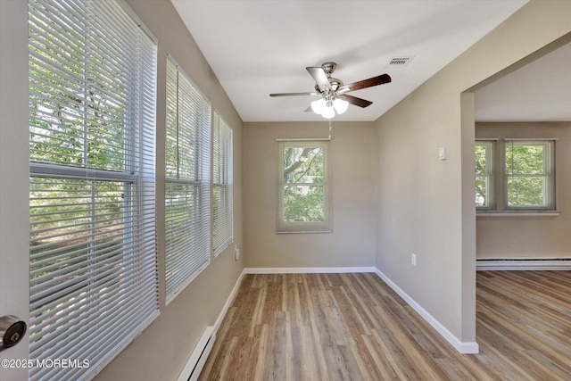9 Deerfield Dr Unit D, Whiting, NJ 08759 - empty room featuring baseboard heating, wood finished floors, and ceiling fan