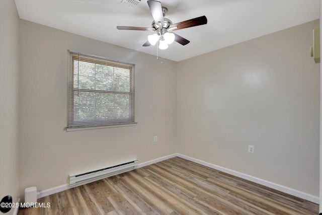 9 Deerfield Dr Unit D, Whiting, NJ 08759 - empty room featuring a baseboard heating unit, wood finished floors, and ceiling fan