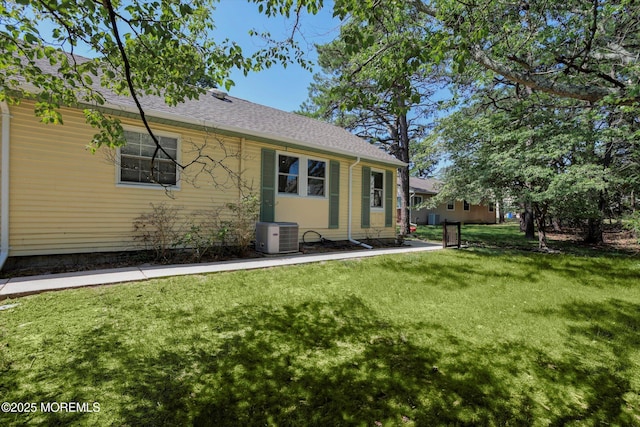9 Deerfield Dr Unit D, Whiting, NJ 08759 - rear view of house featuring a lawn and roof with shingles