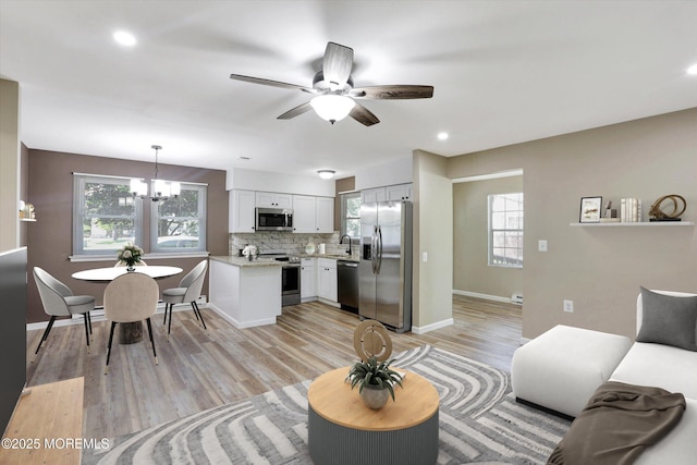 9 Deerfield Dr Unit D, Whiting, NJ 08759 - living room with a chandelier, ceiling fan, plenty of natural light, light wood-type flooring, and recessed lighting