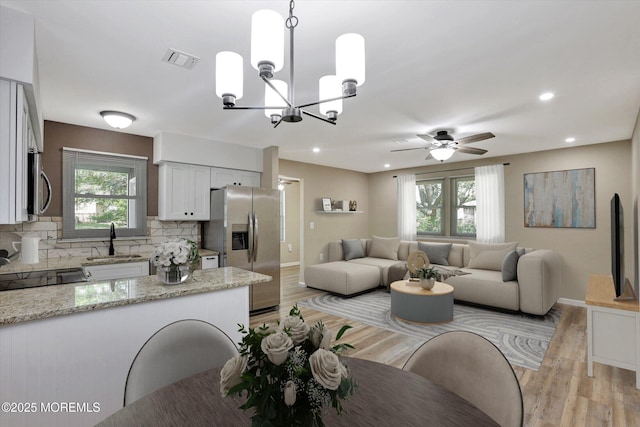 9 Deerfield Dr Unit D, Whiting, NJ 08759 - dining area featuring plenty of natural light, light wood-style floors, a chandelier, a ceiling fan, and recessed lighting