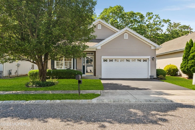18 Osprey Pl, Barnegat, NJ 08005 - view of front of home featuring an attached garage, concrete driveway, and a front lawn