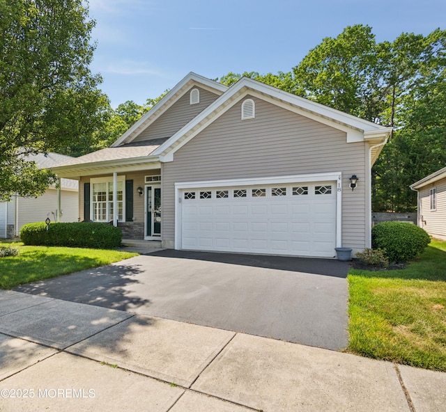 18 Osprey Pl, Barnegat, NJ 08005 - view of front of home with a front lawn, a garage, and driveway