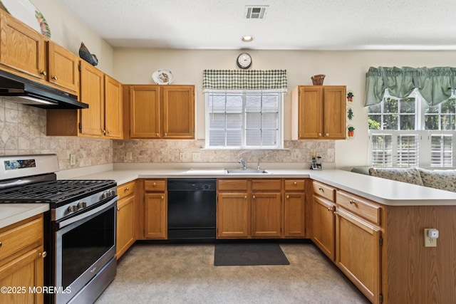 18 Osprey Pl, Barnegat, NJ 08005 - kitchen featuring stainless steel gas range oven, under cabinet range hood, dishwasher, a peninsula, and light countertops