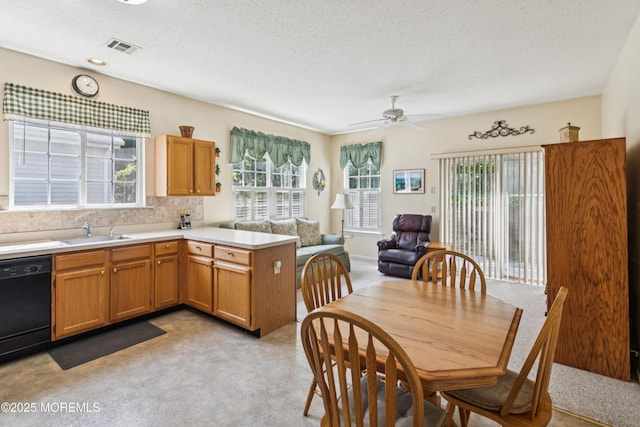 18 Osprey Pl, Barnegat, NJ 08005 - kitchen featuring black dishwasher, a peninsula, light carpet, light countertops, and ceiling fan