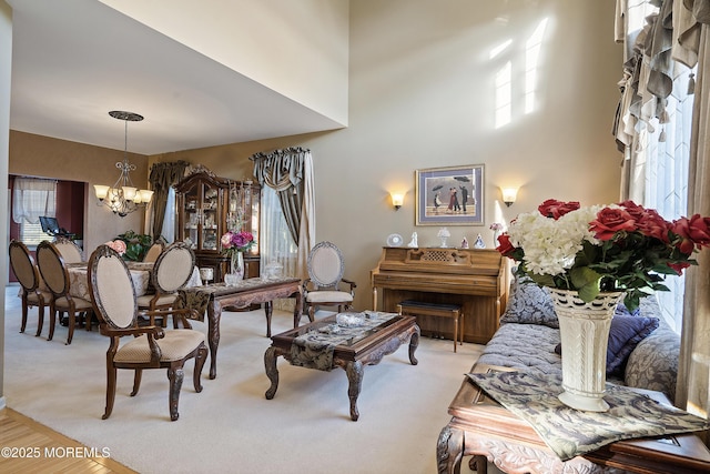 28 Stonehenge Ct, Jackson, NJ 08527 - carpeted living area with a chandelier and a high ceiling