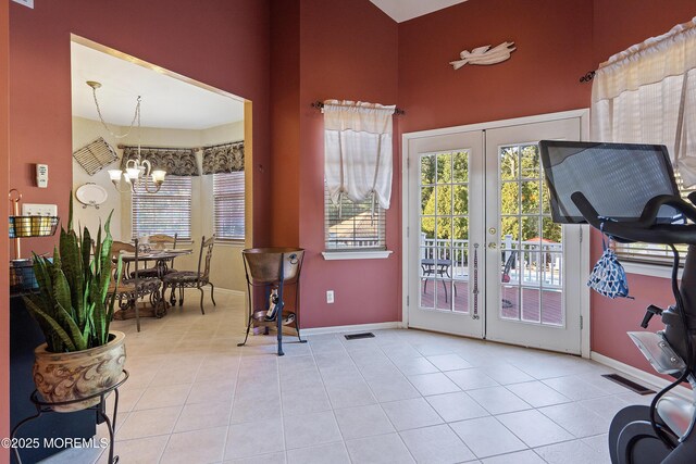 28 Stonehenge Ct, Jackson, NJ 08527 - exercise room with a chandelier, french doors, tile patterned flooring, and a towering ceiling