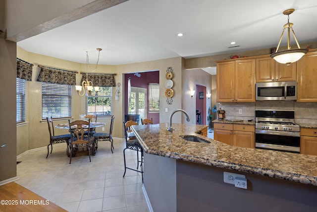 28 Stonehenge Ct, Jackson, NJ 08527 - kitchen featuring stainless steel appliances, dark stone counters, backsplash, decorative light fixtures, and recessed lighting