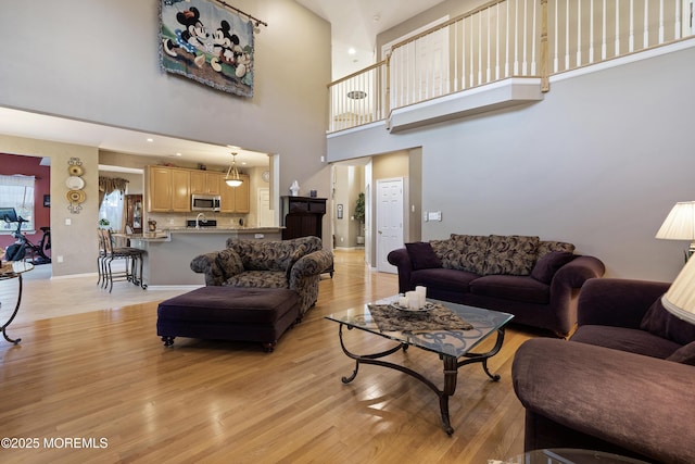 28 Stonehenge Ct, Jackson, NJ 08527 - living area featuring light wood finished floors and a high ceiling