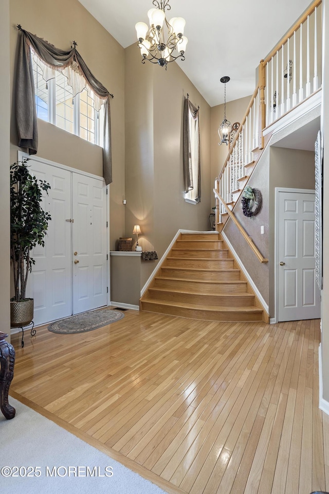 28 Stonehenge Ct, Jackson, NJ 08527 - foyer featuring a chandelier, hardwood / wood-style floors, and stairway