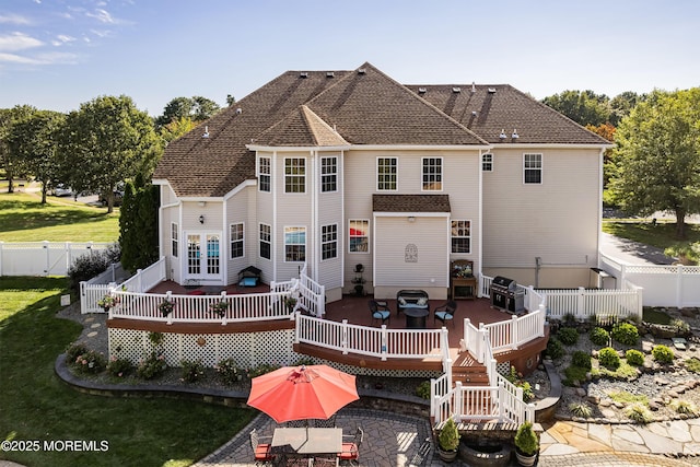 28 Stonehenge Ct, Jackson, NJ 08527 - rear view of house with a wooden deck, a fenced backyard, outdoor dining area, and a patio