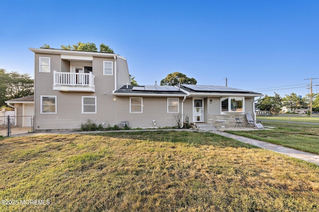 302 Kadlubeck Way, Little Egg Harbor, NJ 08087 - view of front of house featuring roof mounted solar panels, a garage, and a balcony
