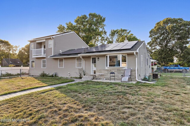 302 Kadlubeck Way, Little Egg Harbor, NJ 08087 - view of front of home with solar panels, a fenced backyard, and entry steps