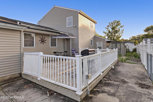 302 Kadlubeck Way, Little Egg Harbor, NJ 08087 - rear view of property with a storage unit, a wooden deck, outdoor dining space, and a fenced backyard